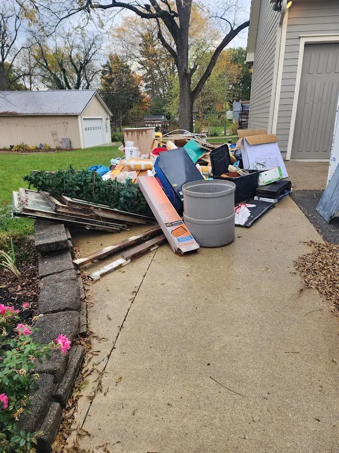Dumpster being loaded with debris for Residential Dumpster Rental in Miami